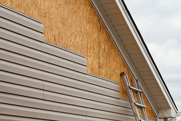 Professional Siding Replacement technician working in Graysville, PA